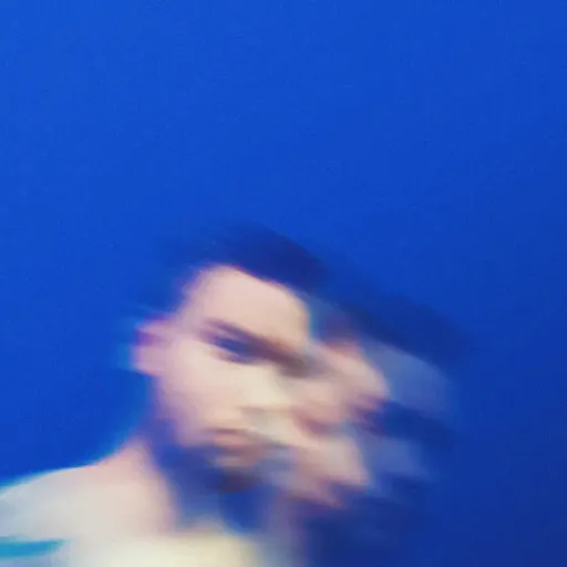 Motion-blurred portrait of a man against a blue background